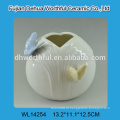 Elegent suporte de vela cerâmica com borboleta branca